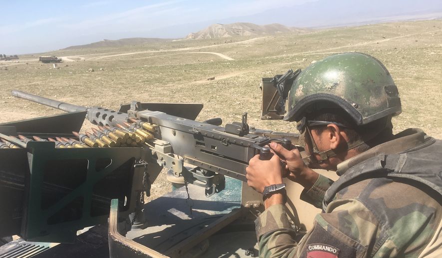 An Afghan commando mans a machine gun at the Pandola village near the site of the U.S. forces&#39; bombing in Achin district of Jalalabad, east of Kabul, Afghanistan, Friday, April 14, 2017. U.S. forces in Afghanistan on Thursday struck an Islamic State tunnel complex in eastern Afghanistan with  the largest non-nuclear weapon every used in combat by the U.S. military, Pentagon officials said. (AP Photo/Rahmat Gul)