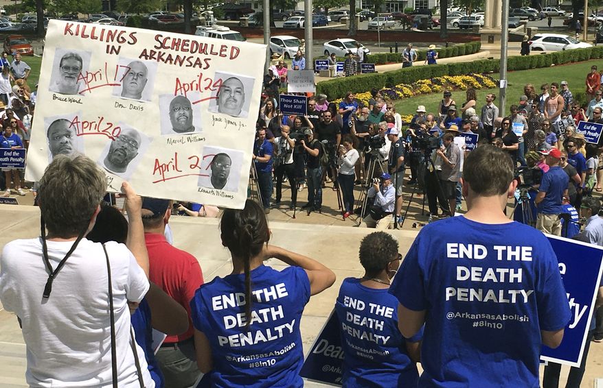 Protesters gather outside the state Capitol building on Friday, April 14, 2017, in Little Rock, Ark., to voice their opposition to Arkansas&#x27; seven upcoming executions. (AP Photo/Kelly P. Kissel)