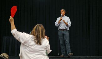Arizona Republican Sen. Jeff Flake tries to answer a question during a town hall Thursday, April 13, 2017, in Mesa, Ariz. Flake is holding his first public event with constituents since January after coming under withering criticism for his voting record and avoiding such gatherings in recent months. (AP Photo/Ross D. Franklin)