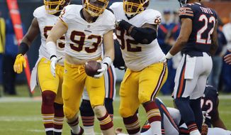 In this photo taken Dec. 13, 2015, Washington Redskins linebacker Trent Murphy (93) celebrates after tackling Chicago Bears quarterback Jay Cutler for a sack and recovering a fumble during the first half of an NFL football game in Chicago. Murphy has been suspended the first four games of next season for violating the NFL’s performance-enhancing drug policy. (AP Photo/Charles Rex Arbogast, File)