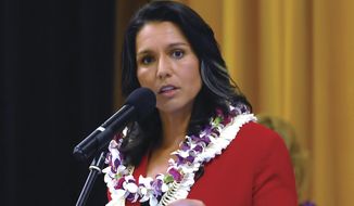 In this Tuesday, April 11, 2017, file photo, U.S. Rep. Tulsi Gabbard speaks at the Kona Town Hall Meeting at Kealakehe Intermediate School in Kona, Hawaii. (Laura Ruminski/West Hawaii Today via AP) ** FILE **