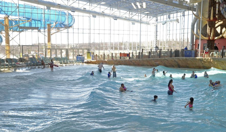 FILE - In this March 8, 2017, file photo, guests take a dip in a newly opened wave pool in the ...