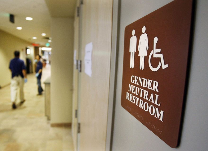 FILE- In this Aug. 23, 2007, file photo, a sign marks the entrance to a gender-neutral restroom at the University of Vermont in Burlington, Vt. All public, single-use restrooms in Vermont would be designated "gender-free" under a new measure gaining momentum in the House. The three-page bill is co-sponsored by nearly a quarter of Vermont's representatives and will get an afternoon of testimony on Tuesday, April 18, 2017. (AP Photo/Toby Talbot, File)