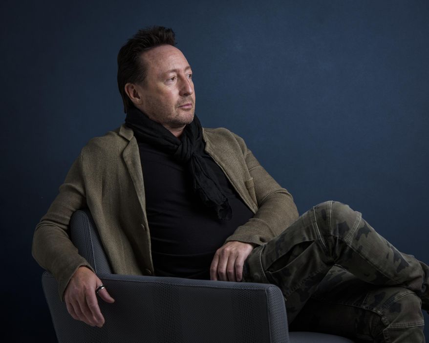 In this April 12, 2017 photo, Julian Lennon poses for a portrait in New York to promote his children's book, "Touch the Earth." (Photo by Drew Gurian/Invision/AP)