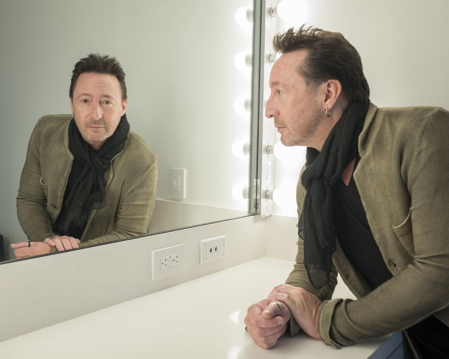 In this April 12, 2017 photo, Julian Lennon poses for a portrait in New York to promote his children's book, "Touch the Earth." (Photo by Drew Gurian/Invision/AP)