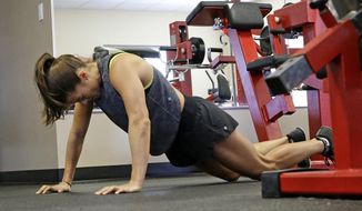 In this Saturday, Feb. 18, 2017 photo, Danica Patrick works out at Daytona International Speedway, in Daytona Beach, Fla. With Danica Patrick&#39;s auto racing career possibly nearing an end in the not-too-distant future, what might have seemed like an off-track hobby in the health and fitness world is being fast-tracked into something far bigger. (AP Photo/John Raoux)