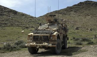 U.S. forces are seen Asad Khil village near the site of a U.S. bombing in the Achin district of Jalalabad, east of Kabul, Afghanistan, Saturday, April 17, 2017. U.S. forces in Afghanistan on Thursday struck an Islamic State tunnel complex in eastern Afghanistan with the largest non-nuclear weapon every used in combat by the U.S. military, Pentagon officials said. (AP Photo/Rahmat Gul)