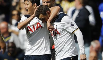 Tottenham Hotspur&#39;s Son Heung-min, left, and Tottenham Hotspur&#39;s Vincent Janssen celebrate after scoring during the Premier League soccer match between Tottenham Hotspur and Bournemouth at White Hart Lane stadium in London, Saturday, April 15, 2017.(AP Photo/Frank Augstein)