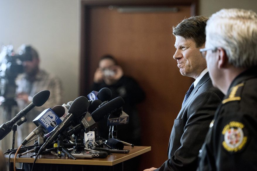 Special Agent in Charge Justin Tolomeo of the FBI's Milwaukee office smiles at at a reporter while discussing the capture of Joseph Jakubowski on Friday, April 14, 2017, during a press conference at the Southern Wisconsin Regional Airport in Janesville, Wis. The fugitive, accused of stealing an arsenal of firearms and sending an anti-government manifesto to the White House, was arrested Friday after a retired school counselor found Jakubowski camping on his property and calmly talked to him before calling authorities. (Angela Major/The Janesville Gazette via AP)