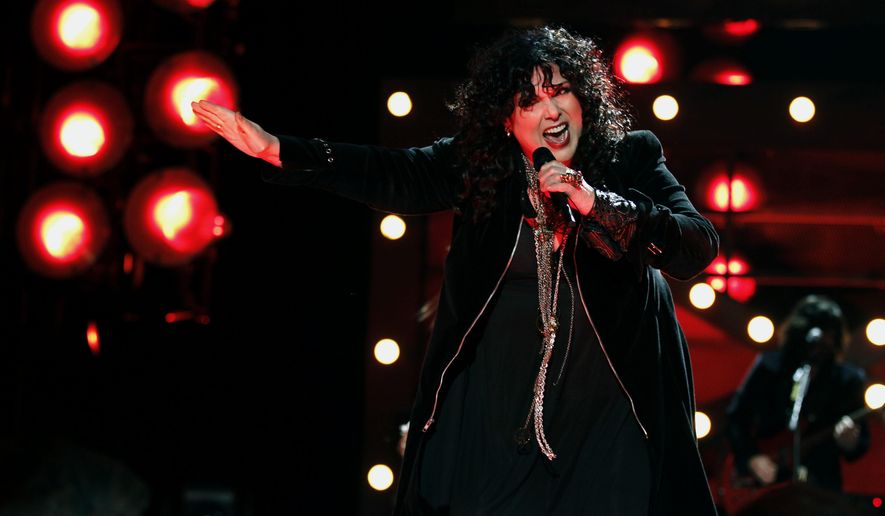 FILE - In this Dec. 3, 2010, file photo, Ann Wilson of the band Heart performs onstage at the "Vh1 Divas Salute the Troops" on in San Diego, Calif. The husband of Heart lead singer Ann Wilson has been sentenced for allegedly choking her nephews during a concert in suburban Seattle. Seattlepi.com reported Friday, April 14, 2017, that Dean Wetter pleaded guilty March 9 to two counts of assault. He was sentenced as part of a plea deal to 364 days in jail, with all the time suspended. (AP Photo/Matt Sayles, File)