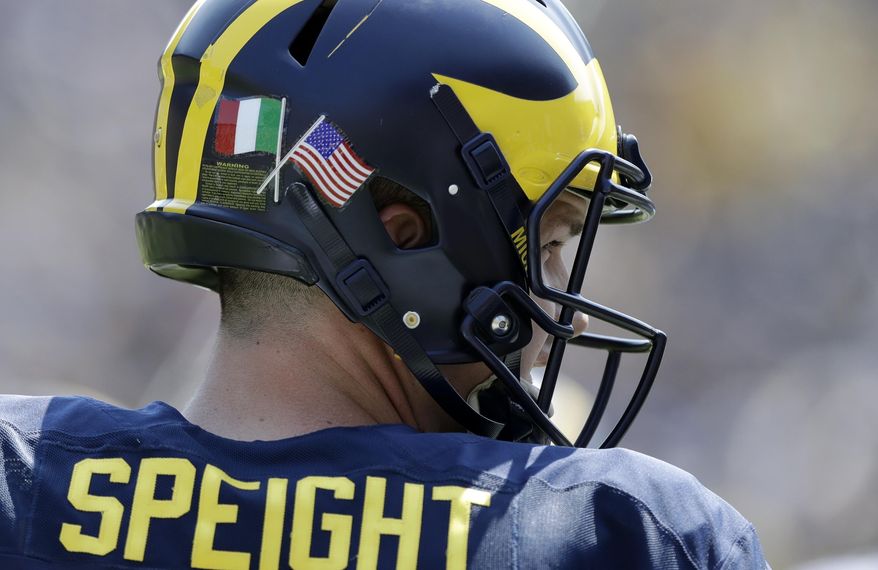 Michigan quarterback Wilton Speight (3) sports a decal of the flags of Italy and the United States during the NCAA college football team's spring game, Saturday, April 15, 2017, in Ann Arbor, Mich. The team is planning a trip to Italy later in the month. (AP Photo/Carlos Osorio)