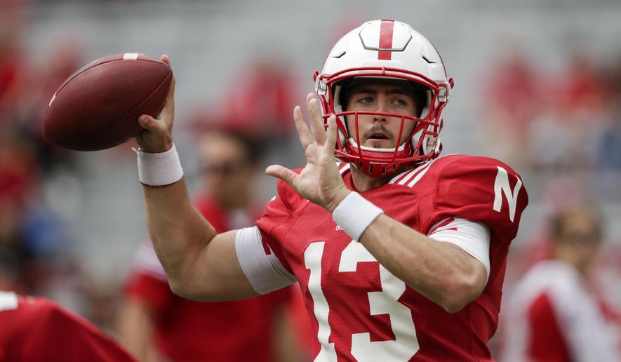 Nebraska Red quarterback Tanner Lee (13) throws during warmups before the annual NCAA college football Red-White spring game, in Lincoln, Neb., Saturday, April 15, 2017. (AP Photo/Nati Harnik)