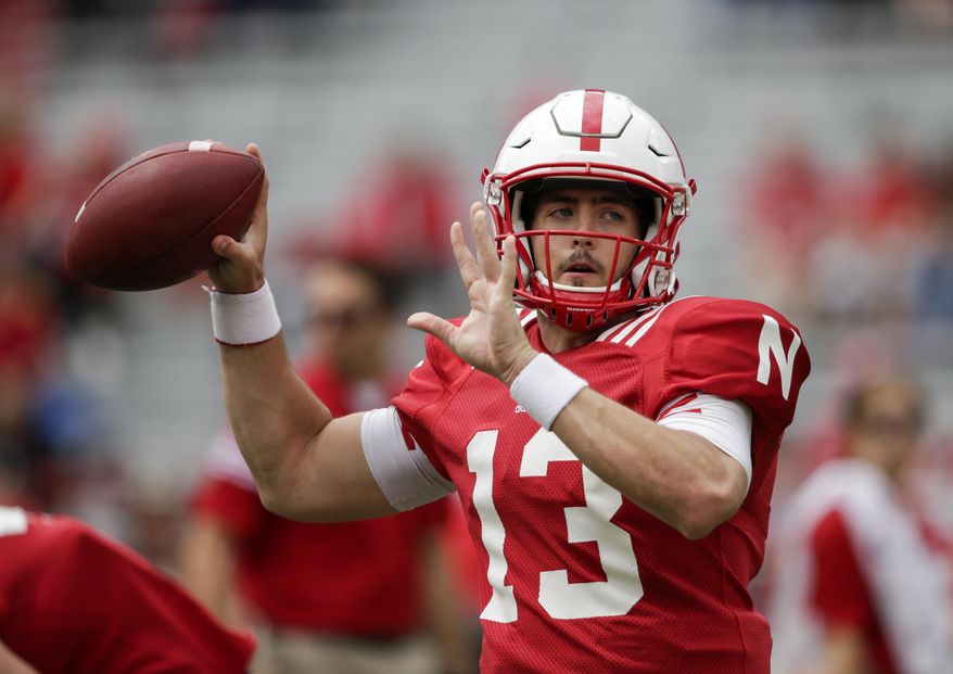 Nebraska Red quarterback Tanner Lee (13) throws during warmups before the annual NCAA college football Red-White spring game, in Lincoln, Neb., Saturday, April 15, 2017. (AP Photo/Nati Harnik)