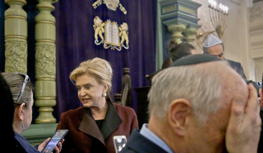 In this March 3, 2017, photo, Congresswoman Carolyn Maloney, center, a member of Congress&#x27;s bipartisan task force combating anti-Semitism, speaks with a reporter after holding a news conference to address bomb treats against Jewish organizations and vandalism at Jewish cemeteries at the Park East Synagogue in New York. Kendall Sullivan, a Connecticut man who posted threats against Jews and synagogues on a metal music internet forum plans to argue at his sentencing that he has served enough time in prison. Sullivan is scheduled to go before a U.S. District judge in Bridgeport on Monday, April 17. He pleaded guilty in January to perpetrating a hoax and originally faced three federal charges of making online threats. (AP Photo/Bebeto Matthews, File)