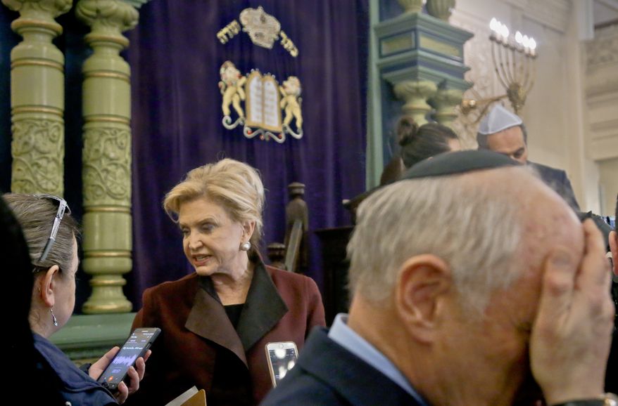 In this March 3, 2017, photo, Congresswoman Carolyn Maloney, center, a member of Congress's bipartisan task force combating anti-Semitism, speaks with a reporter after holding a news conference to address bomb treats against Jewish organizations and vandalism at Jewish cemeteries at the Park East Synagogue in New York. Kendall Sullivan, a Connecticut man who posted threats against Jews and synagogues on a metal music internet forum plans to argue at his sentencing that he has served enough time in prison. Sullivan is scheduled to go before a U.S. District judge in Bridgeport on Monday, April 17. He pleaded guilty in January to perpetrating a hoax and originally faced three federal charges of making online threats. (AP Photo/Bebeto Matthews, File)