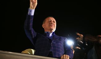 Turkey&#x27;s President Recep Tayyip Erdogan waves to supporters in Istanbul, Turkey, on Sunday, April 16, 2017. Erdogan declared victory in Sunday&#x27;s historic referendum that will grant sweeping powers to the presidency, hailing the result as a &quot;historic decision.&quot; (AP Photo/Lefteris Pitarakis)
