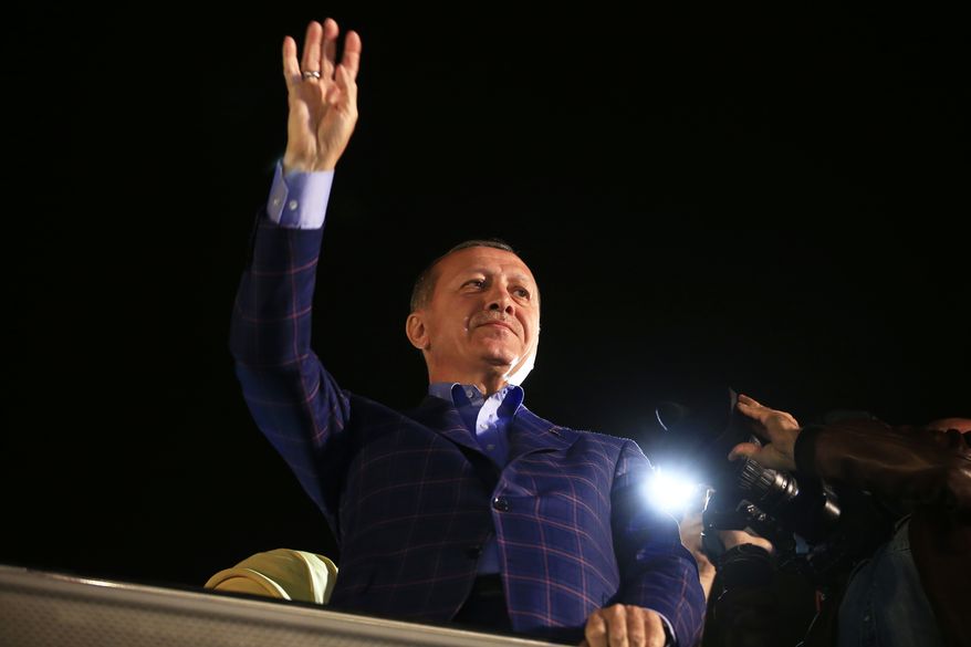 Turkey&#x27;s President Recep Tayyip Erdogan waves to supporters in Istanbul, Turkey, on Sunday, April 16, 2017. Erdogan declared victory in Sunday&#x27;s historic referendum that will grant sweeping powers to the presidency, hailing the result as a &quot;historic decision.&quot; (AP Photo/Lefteris Pitarakis)
