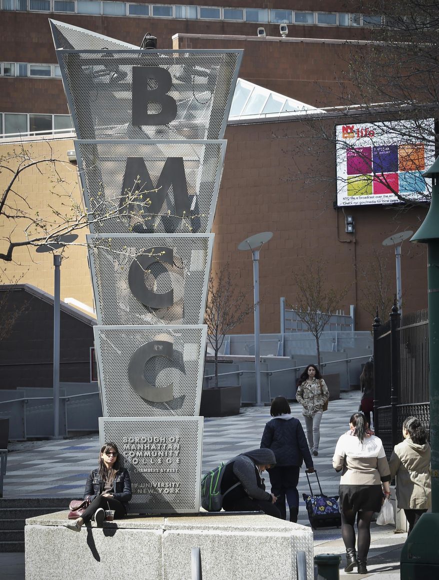 In this April 13, 2017 photo, people walk near the main entrance to the Borough of Manhattan Community College in New York, where new legislation would allow some students to attend tuition-free. New York's plan would cover in-state public college tuition for full-time students whose families earn $125,000 or less. Some experts are concerned that the way the plan is set up, it would actually do little to help the neediest students, whose tuition is already covered by other aid. They also question that the plain doesn't address the many other college costs beyond tuition. (AP Photo/Bebeto Matthews)