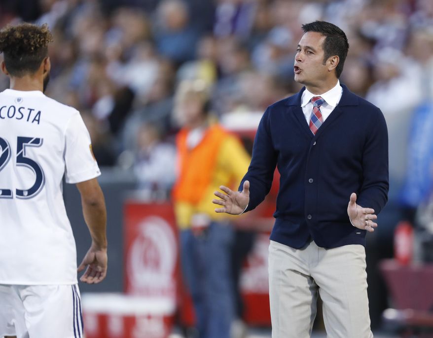 Real Salt Lake midfielder Danilo Acosta, left, is directed by head coach Mike Petke while facing the Colorado Rapids in the first half of an MLS soccer match, Saturday, April 15, 2017, in Commerce City, Colo. (AP Photo/David Zalubowski)