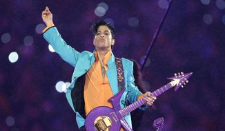 In this Feb. 4, 2007, file photo, Prince performs during the halftime show at the Super Bowl XLI football game in Miami. (AP Photo/Chris O&#39;Meara, File)