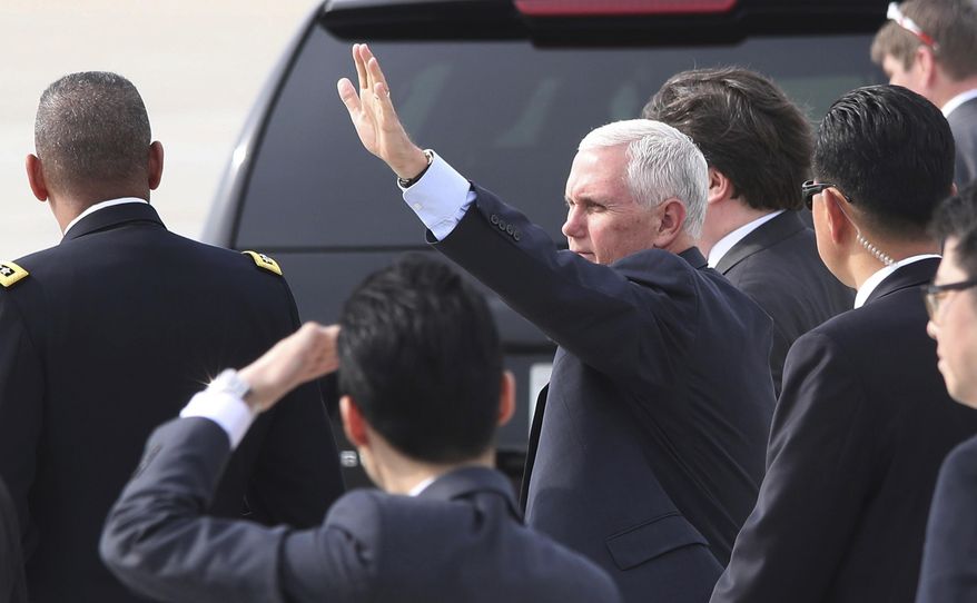 U.S. Vice President Mike Pence waves upon his arrival at Osan Air Base in Pyeongtaek, South Korea, Sunday, April 16, 2017. Pence arrived in South Korea on Sunday to begin a 10-day trip to Asia that comes amid turmoil on the Korean Peninsula over North Korea's threats to advance its nuclear and defense capabilities, and just after a failed missile launch by the North. (Kim Do-hoon/Yonhap via AP)