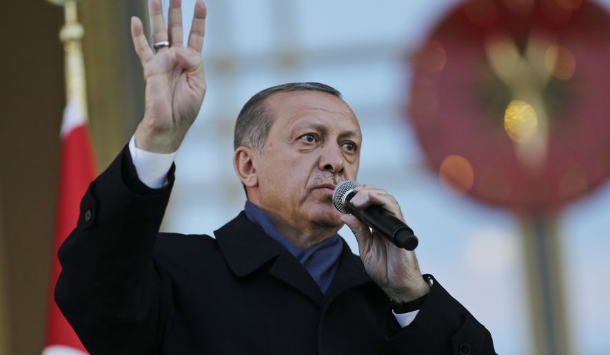 Turkey&#x27;s President Recep Tayyip Erdogan, delivers a speech during a rally of supporters a day after the referendum, outside the Presidential Palace, in Ankara, Turkey, Monday, April 17, 2017. Turkey&#x27;s main opposition party urged the country&#x27;s electoral board Monday to cancel the results of a landmark referendum that granted sweeping new powers to Erdogan, citing what it called substantial voting irregularities. (AP Photo/Burhan Ozbilici)