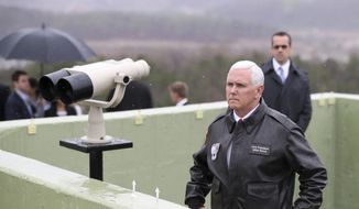 U.S. Vice President Mike Pence looks at the North side from Observation Post Ouellette in the Demilitarized Zone (DMZ), near the border village of Panmunjom, which has separated the two Koreas since the Korean War, South Korea, Monday, April 17, 2017. Viewing his adversaries in the distance, Pence traveled to the tense zone dividing North and South Korea and warned Pyongyang that after years of testing the U.S. and South Korea with its nuclear ambitions, &quot;the era of strategic patience is over.&quot; (AP Photo/Lee Jin-man)