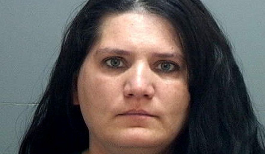 This undated booking photo provided by the Salt Lake County Jail shows Nannette Perkins who was arrested Sunday, April 16, 2017, at her Taylorsville home after Salt Lake City police received a tip about her identity. Perkins is believed to be the pajama-wearing robber in at least six bank robberies in the Salt Lake City area. (Salt Lake County Jail via AP)