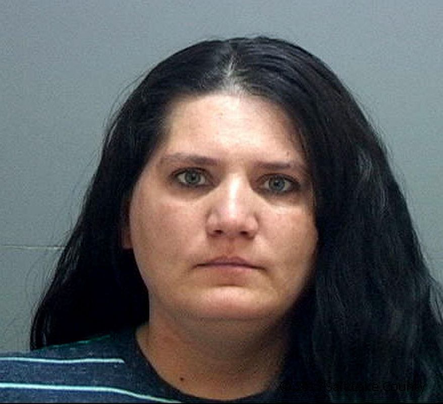 This undated booking photo provided by the Salt Lake County Jail shows Nannette Perkins who was arrested Sunday, April 16, 2017, at her Taylorsville home after Salt Lake City police received a tip about her identity. Perkins is believed to be the pajama-wearing robber in at least six bank robberies in the Salt Lake City area. (Salt Lake County Jail via AP)