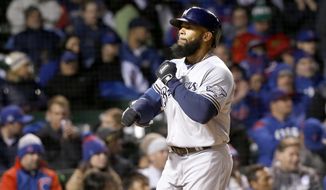 Milwaukee Brewers&#39; Eric Thames celebrates his home run off Chicago Cubs starting pitcher John Lackey, during the third inning of a baseball game Monday, April 17, 2017, in Chicago. (AP Photo/Charles Rex Arbogast)