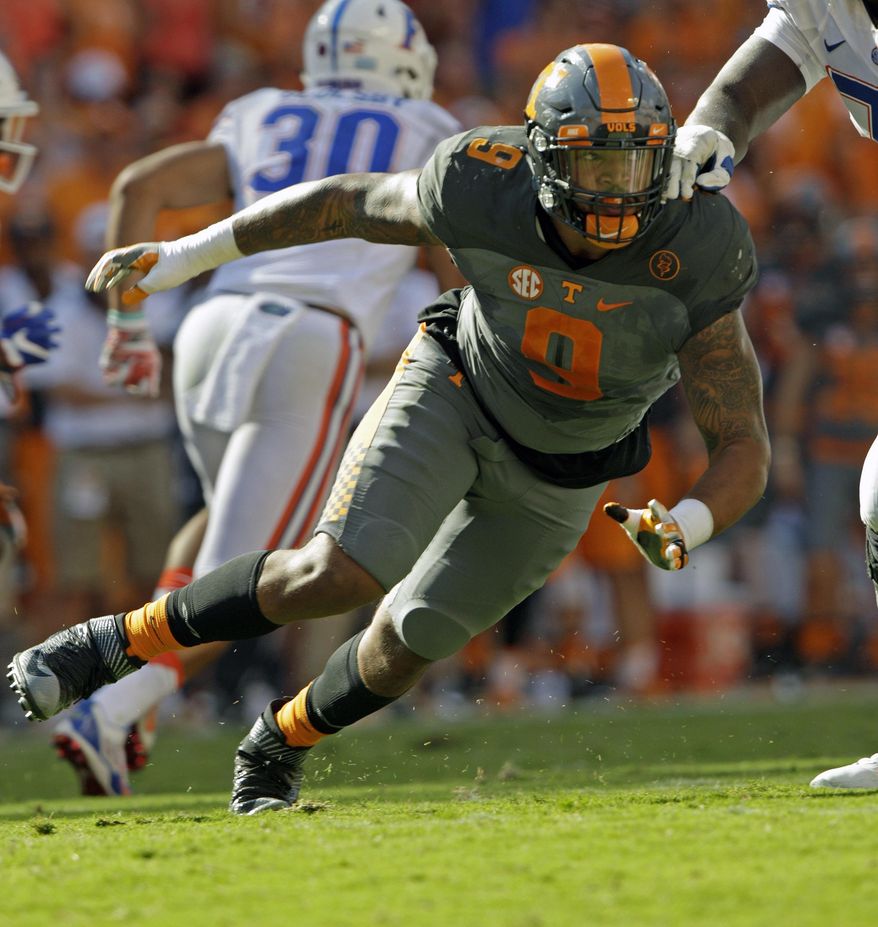 FILE - In this Sept. 24, 2016, file photo, Tennessee defensive end Derek Barnett (9) plays against Florida in an NCAA college football game, in Knoxville, Tenn. They began their college careers at the same time, played in the same conference and had similar production. Now they’re both ready to launch their pro careers. Yet while Myles Garrett is considered the likely No. 1 overall pick in this month’s NFL Draft, Derek Barnett likely won’t get taken until later in the first round. (AP Photo/Wade Payne, File)