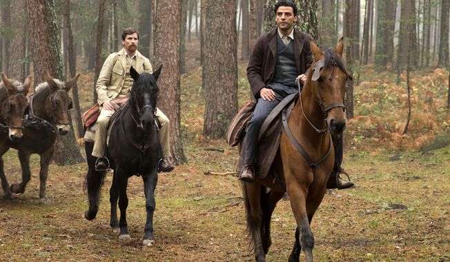 This image released by Open Road Films shows Christian Bale, left, and Oscar Isaac in a scene from &amp;quot;The Promise.&amp;quot; (Jose Haro/Open Road Films via AP)