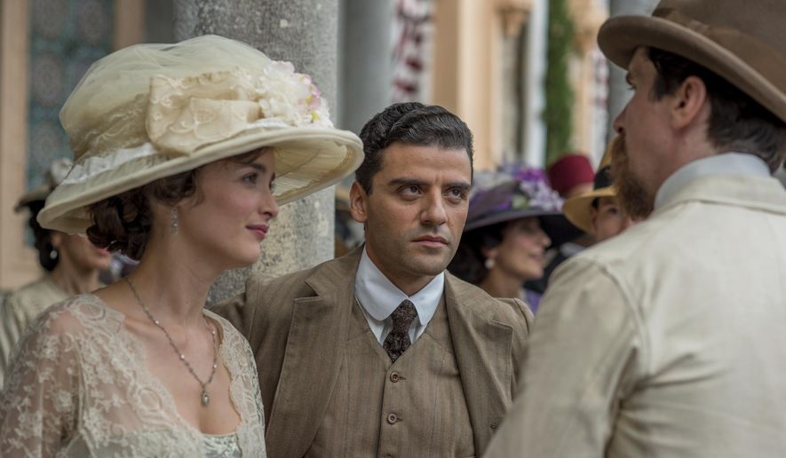 This image released by Open Road Films shows Charlotte Le Bon, from left, Oscar Isaac and Christian Bale in a scene from "The Promise." (Jose Haro/Open Road Films via AP)