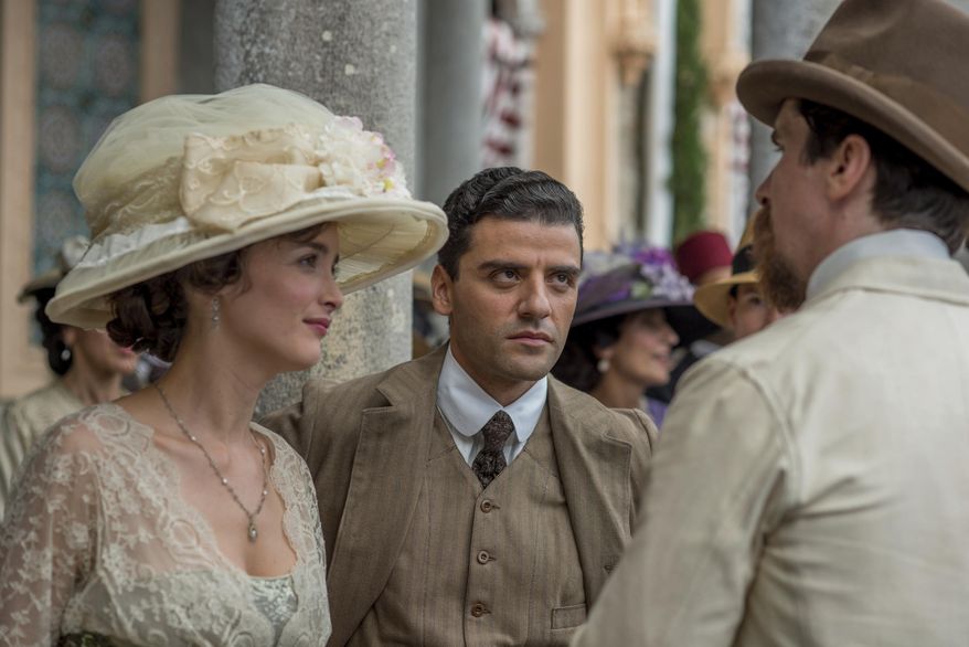 This image released by Open Road Films shows Charlotte Le Bon, from left, Oscar Isaac and Christian Bale in a scene from "The Promise." (Jose Haro/Open Road Films via AP)