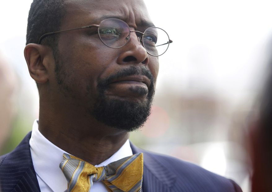 Norfolk, Va., treasurer Anthony Burfoot pauses to talk with the media prior to entering U.S. District Court for his sentencing on Monday, April 17, 2017. Burfoot maintained his innocence and said this has been hard on his family. Burfoot was sentenced to six years in federal prison on public corruption and perjury charges. (Vicki Cronis-Nohe/The Virginian-Pilot via AP)