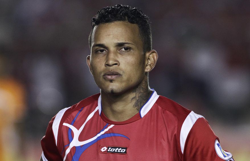 FILE - In this Friday, June 7, 2013, file photo, Panama's Amilcar Henriquez stands during the playing of the Mexican national anthem before a World Cup qualifying soccer match against Mexico in Panama City. Police in Panama said Henriquez was shot dead while leaving his home on Saturday, April 15, 2017. (AP Photo/Arnulfo Franco, File)