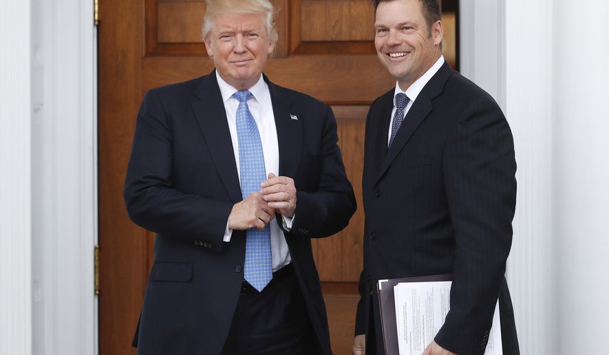 FILE - In this Nov. 20, 2016, file photo, Kansas Secretary of State Kris Kobach, right, holds a stack of papers as he meets with then President-elect Donald Trump at the Trump National Golf Club Bedminster clubhouse in Bedminster, N.J. A federal judge has ordered Kansas&#39; top elections official to turn over a proposed changes to federal voting rights laws that he took to a meeting with President Trump. After privately examining the documents, U.S. Magistrate James O&#39;Hara ruled Monday, April 17, 2017, that parts of documents from Kobach are &amp;quot;unquestionably relevant&amp;quot; to a lawsuit challenging a state law requiring voters provide proof of their U.S. citizenship when registering. (AP Photo/Carolyn Kaster, File)