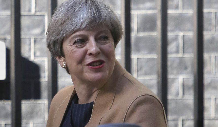 Prime Minister Theresa May leaves 10 Downing Street in London, Tuesday April 18, 2017. May has called for a snap June 8 General Election, seeking to strengthen her hand in ongoing European Union exit talks and tighten her grip on a fractious Conservative Party. (Philip Toscano/PA via AP)