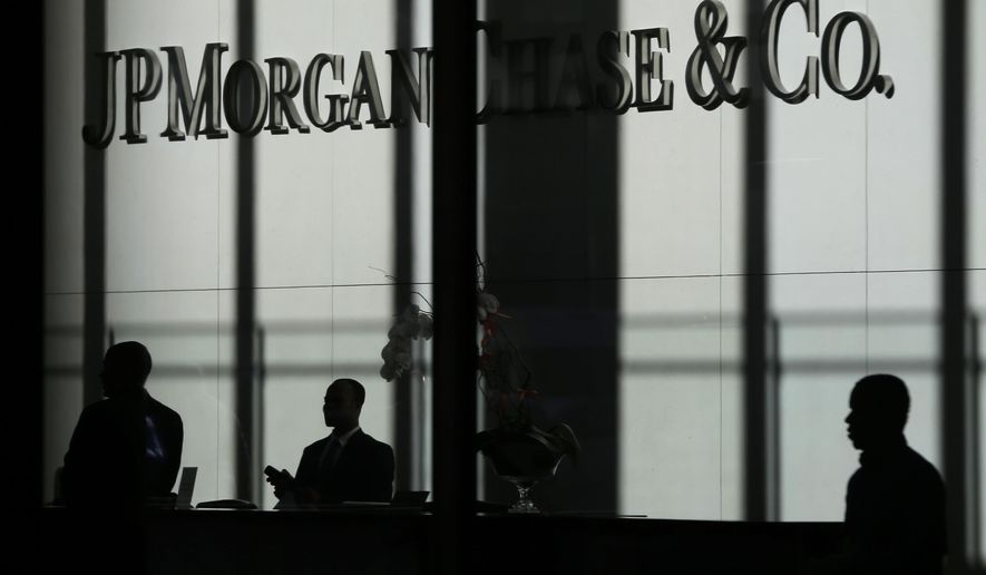 In this Monday, Oct. 21, 2013, file photo, the JPMorgan Chase &amp;amp; Co. logo is displayed at their headquarters in New York. Banking executives and consultants who normally focus on checking accounts and credit cards spent a recent conference talking about “cross-selling” and “incentive compensation.” Those are code words for Wells Fargo, and the up to 2 million accounts that its employees opened without customer permission as they sought to meet unrealistic sales goals. JPMorgan Chase officials say they&#39;ve looked at their bank&#39;s sales behavior and have found nothing amiss. (AP Photo/Seth Wenig, File)
