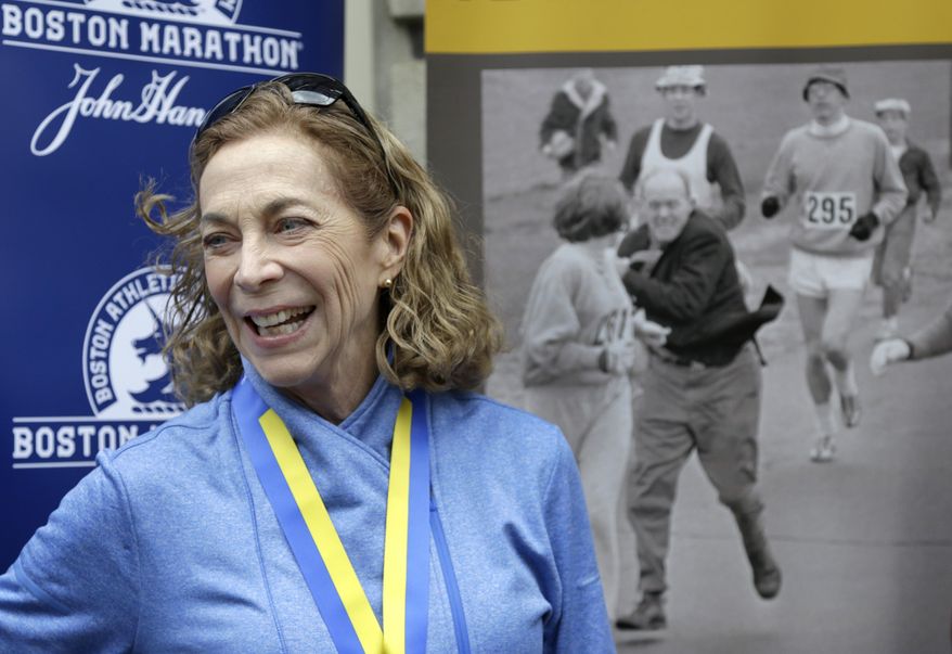 Kathrine Switzer, the first official woman entrant in the Boston Marathon 50 years ago, laughs during a news conference, Tuesday, April 18, 2017, in Boston, where her bib No. 261 was retired in her honor by the Boston Athletic Association. (AP Photo/Elise Amendola)