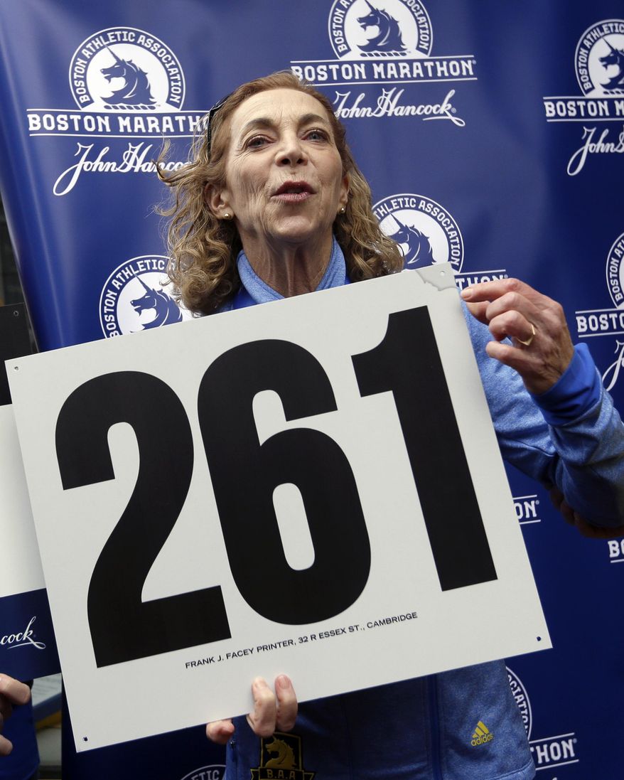 Kathrine Switzer, the first official woman entrant in the Boston Marathon 50 years ago, reacts at a news conference, Tuesday, April 18, 2017, in Boston, where her bib No. 261 was retired in her honor by the Boston Athletic Association. (AP Photo/Elise Amendola)