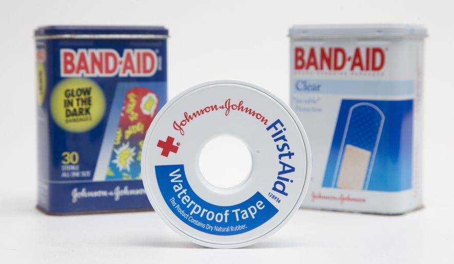 In this Tuesday, Sept. 13, 2016, photo, a selection of Johnson & Johnson brand first aid products are shown in Surfside, Fla. Johnson & Johnson reports financial earnings Tuesday, April 18, 2017. (AP Photo/Wilfredo Lee)