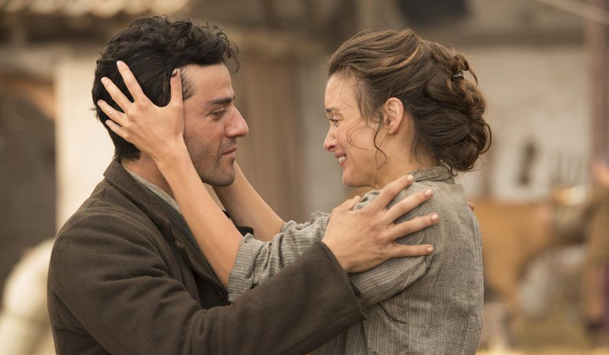 This image released by Open Road Films shows Oscar Isaac , left, and Charlotte Le Bon in a scene from "The Promise." (Jose Haro/Open Road Films via AP)