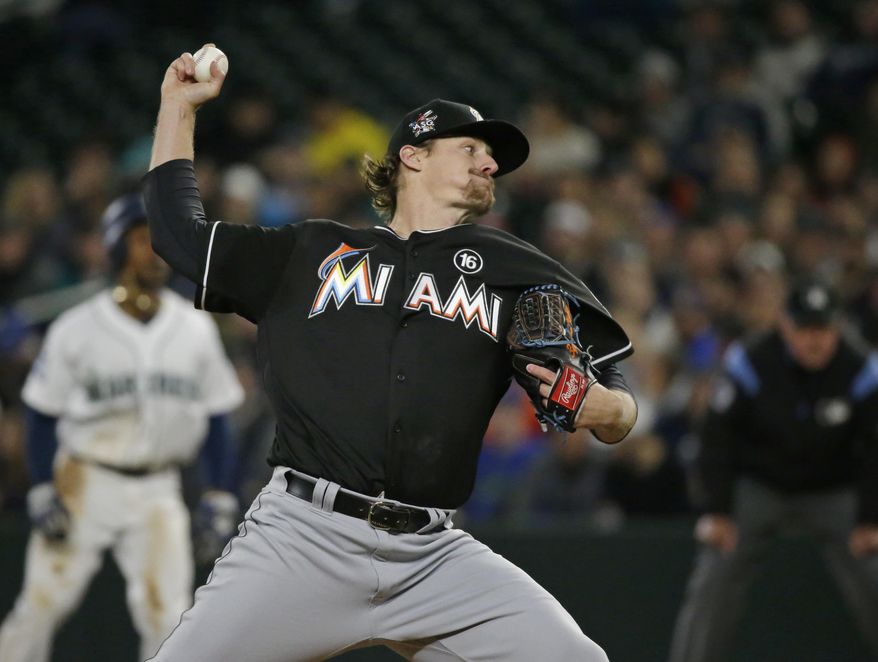 Miami Marlins starting pitcher Tom Koehler throws against the Seattle Mariners in the first inning of a baseball game, Monday, April 17, 2017, in Seattle. (AP Photo/Ted S. Warren)