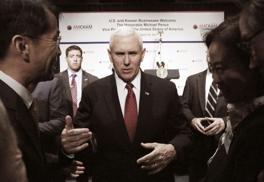 U.S. Vice President Mike Pence talks with members of the American Chamber of Commerce at the Grand Hyatt Hotel in Seoul, South Korea, Tuesday, April 18, 2017. (AP Photo/Ahn Young-joon, Pool)