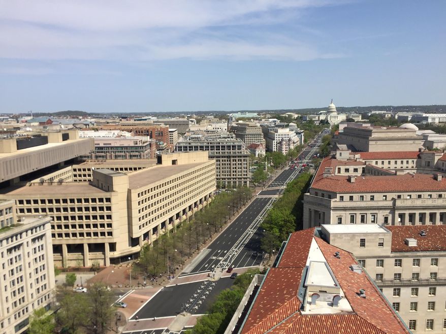 This April 13, 2017 image shows a view from the clock tower at the Old Post Office, a historic building in Washington D.C., where the Trump International Hotel is located. The clock tower is operated by the National Park Service and was recently reopened to the public for tours. (AP Photos/Beth J. Harpaz)