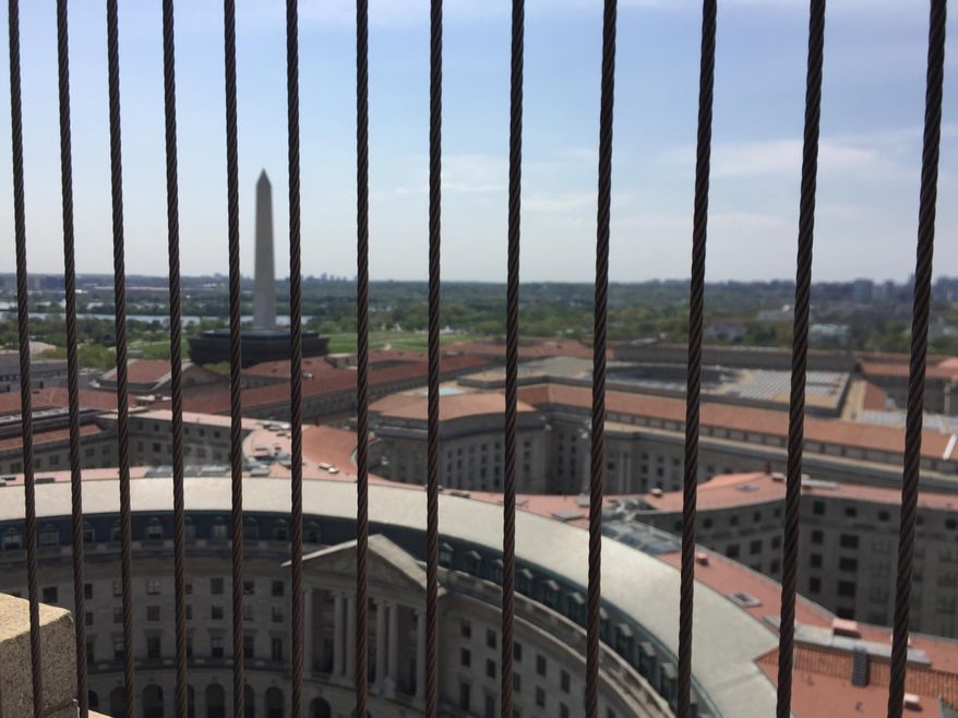 This April 13, 2017 image shows a view from the clock tower at the Old Post Office, a historic building in Washington D.C., where the Trump International Hotel is located. The clock tower is operated by the National Park Service and was recently reopened to the public for tours. (AP Photos/Beth J. Harpaz)