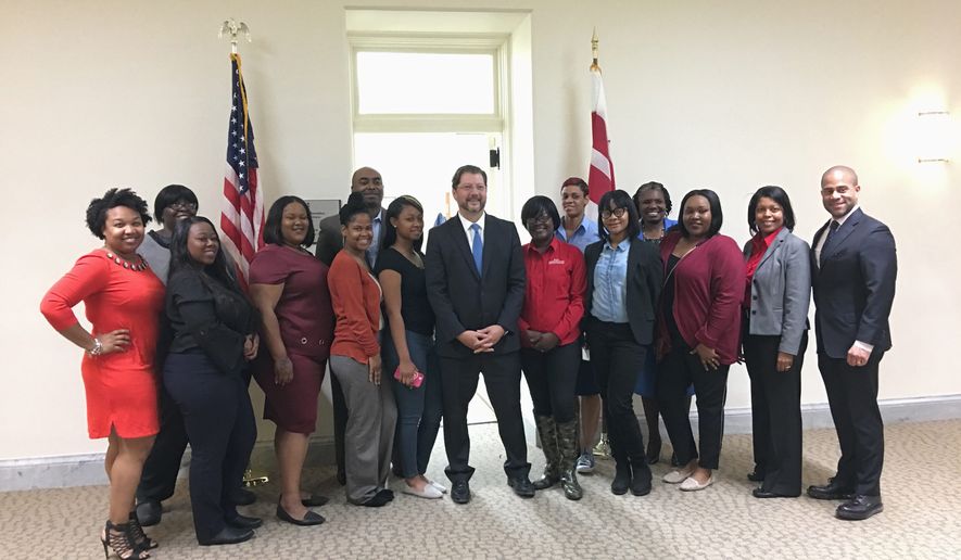 Laura Kelly / The Washington Times 
 D.C. Council member David Grosso meets with AmeriHealth Caritas D.C. 
 employees and interns on Wednesday at the Wilson Building.