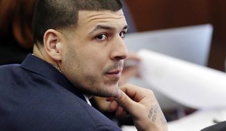 FILE - In this Wednesday, March 15, 2017, file photo, Defendant Aaron Hernandez listens during his double murder trial in Suffolk Superior Court, in Boston. Massachusetts prison officials said Hernandez hanged himself in his cell and pronounced dead at a hospital early Wednesday, April 19, 2017. (AP Photo/Elise Amendola, Pool, File)