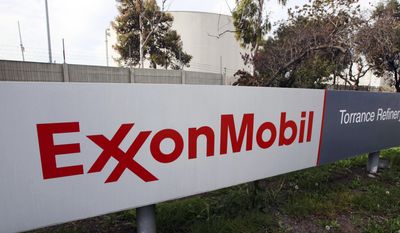 FILE - This Jan. 30, 2012, file photo, shows the sign for the Exxon Mobil Torrance Refinery in Torrance, Calif. A person familiar with the matter said Wednesday, April 19, 2017, that Exxon Mobil is seeking permission from the U.S. government for approval to resume drilling around the Black Sea with a Russian partner, state-owned Rosneft. (AP Photo/Reed Saxon, File)
